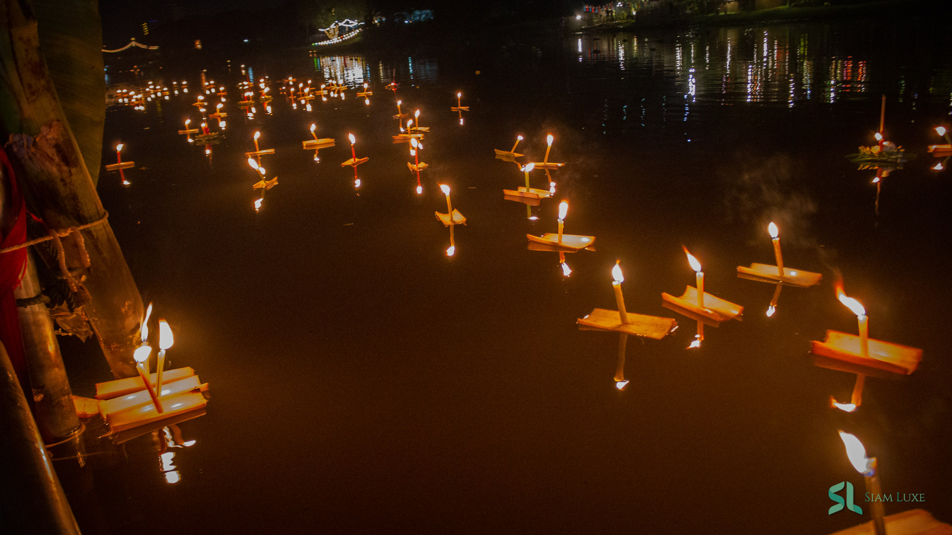 Hundreds of mini Krathong sais float on the river during the Loy Krathong festival in Thailand